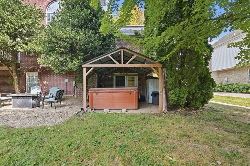Hot tub under a pergola on the lower patio