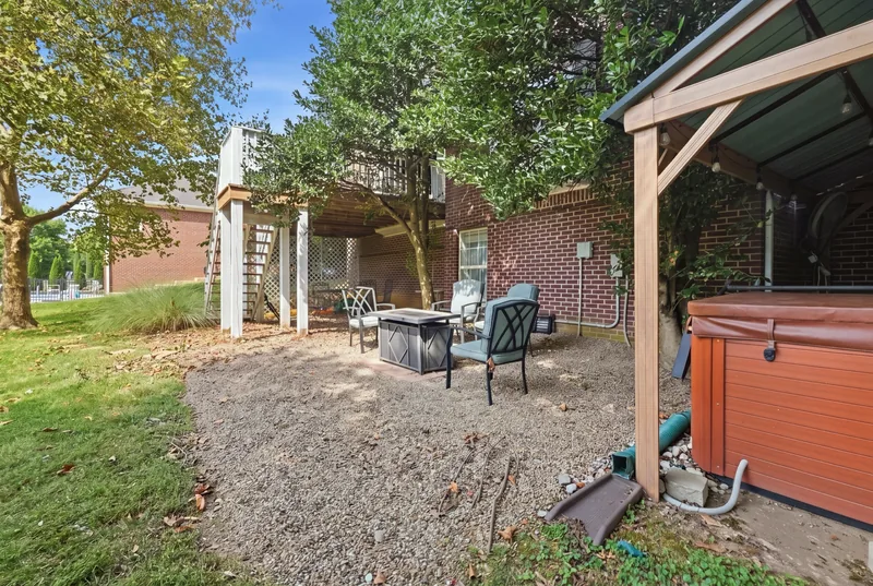 Hot tub under a pergola on the lower patio