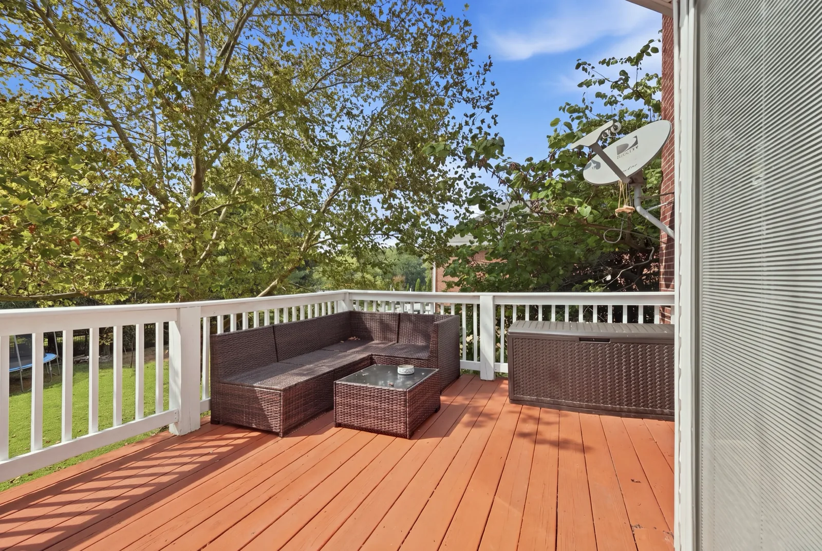 The deck off the kitchen with outdoor seating