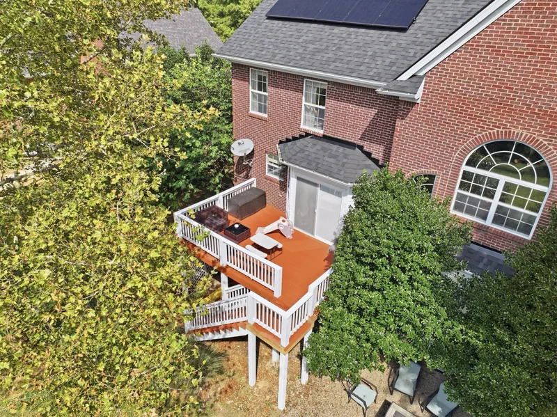 Back of the house from above, with the deck and solar panels